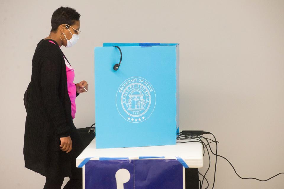 Latia Cross casts her ballot during a past Chatham County Municipal Election.