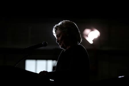 U.S. Democratic presidential nominee Hillary Clinton pauses while speaking at a campaign event about college affordability with U.S. Senator Bernie Sanders at the University of New Hampshire in Durham, New Hampshire, United States September 28, 2016. REUTERS/Brian Snyder