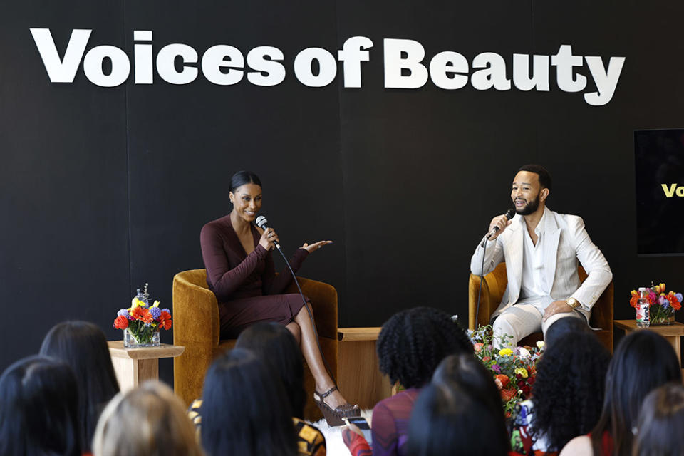 Brooke DeVard and John Legend speak onstage during The Voices of Beauty Summit at California Market Center on March 27, 2024 in Los Angeles, California.