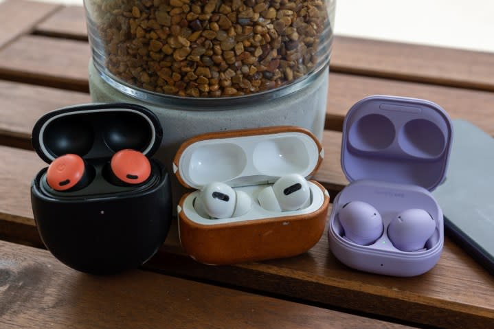 A collection of earbuds open on a table.