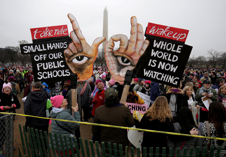 <p>Banners are held aloft during Women’s March on Washington in reaction to U.S. President Donald Trump’s inauguration in Washington, U.S., January 21, 2017. (REUTERS/Joshua Roberts) </p>