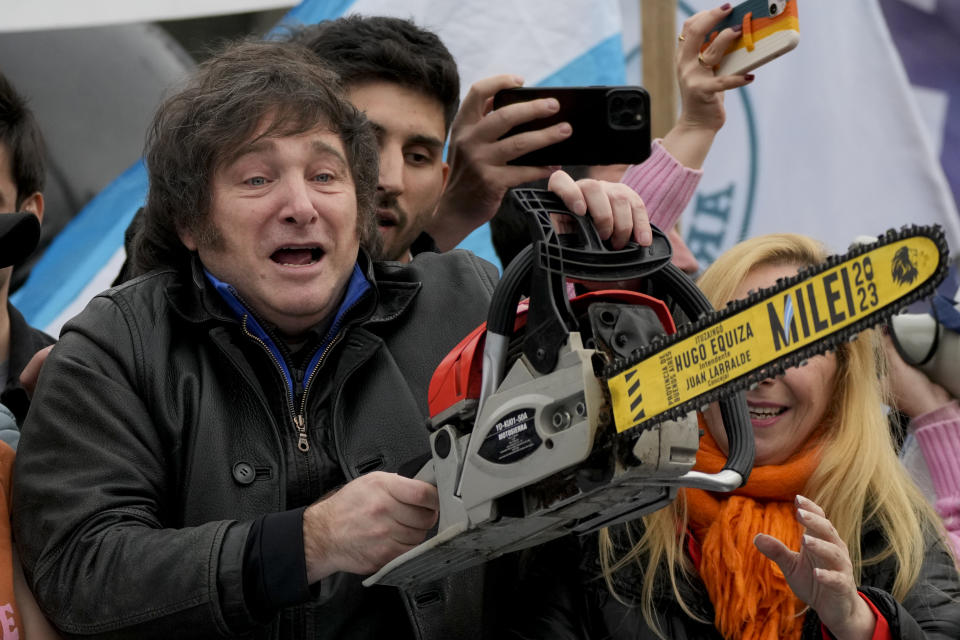 Presidential hopeful of the Liberty Advances coalition Javier Milei brandishes a chainsaw during a campaign event in La Plata, Argentina, Tuesday, Sept. 12, 2023. General elections are set in Argentina for Oct. 22. (AP Photo/Natacha Pisarenko)