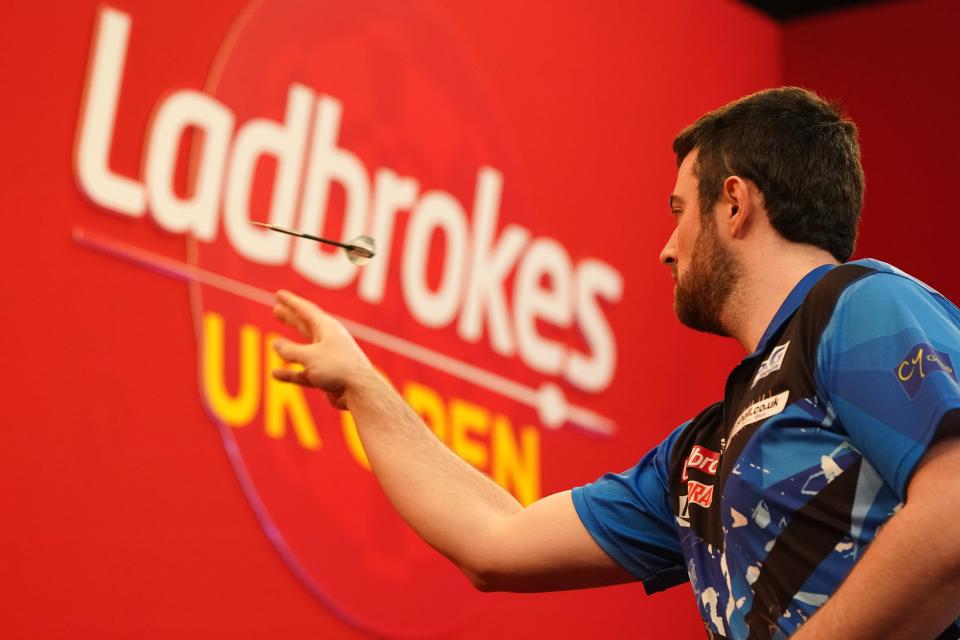 A player throws a dart at the Ladbrokes UK Open (PA Wire)