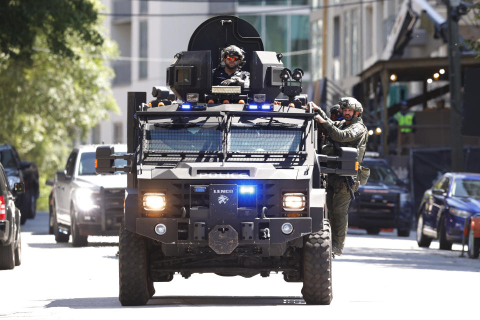 Law enforcement officers arrive near the scene of an active shooter on Wednesday, May 3, 2023 in Atlanta. Atlanta police said there had been no additional shots fired since the initial shooting unfolded inside a building in a commercial area with many office towers and high-rise apartments. (AP Photo/Alex Slitz)