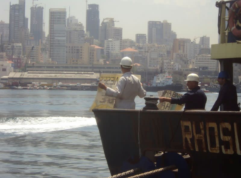 Captain Boris Prokoshev and crew members demand their release from the arrested cargo vessel Rhosus in the port of Beirut