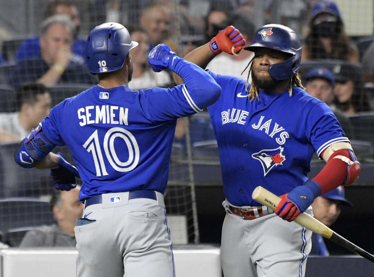 Toronto Blue Jays' Alejandro Kirk breaks his bat as he hits an RBI