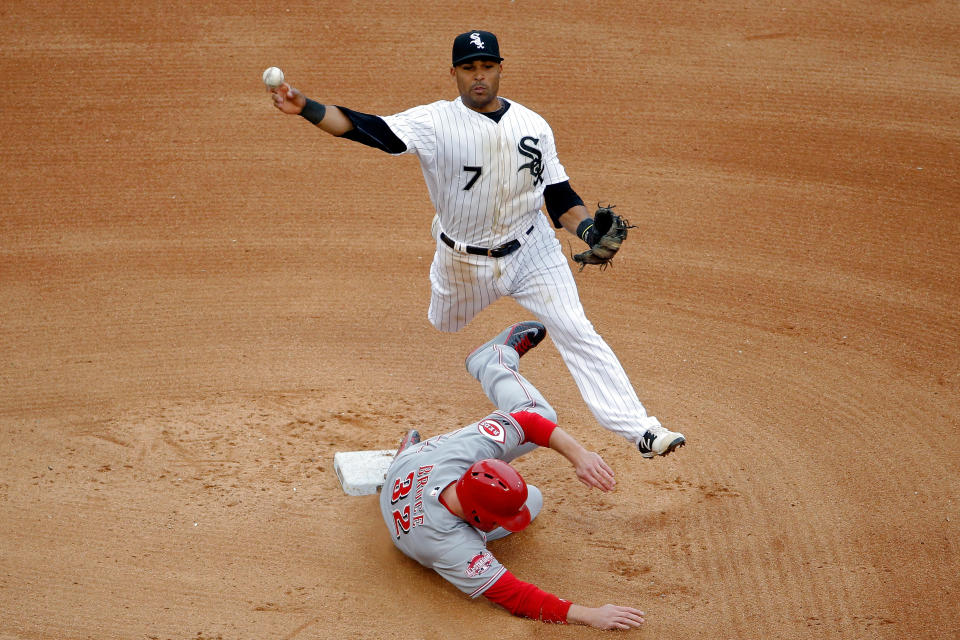 Micah Johnson #7 of the Chicago White Sox leaps in the air to throw to first base as Jay Bruce #32 of the Cincinnati Reds slides into second base during the sixth inning in the first game of a doubleheader on May 9, 2015 at U.S. Cellular Field in Chicago, Illinois. (Photo by Jon Durr/Getty Images)<span class="copyright">Getty Images</span>