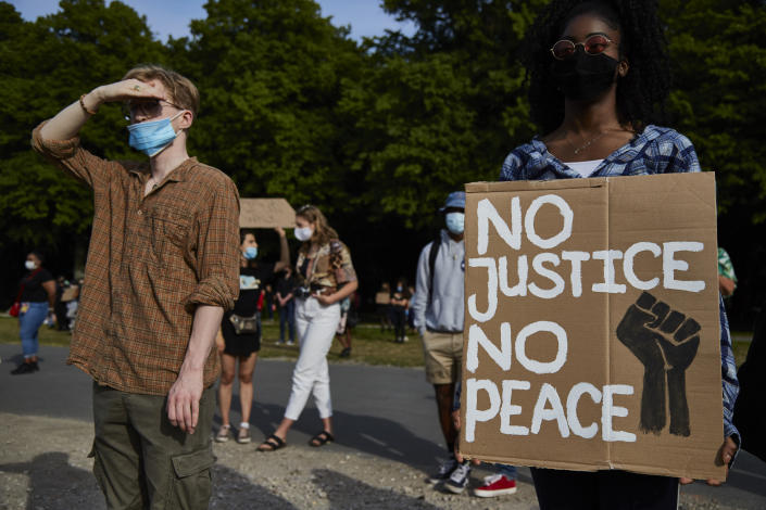THE HAGUE, NETHERLANDS - JUNE 02: A protester holds a sign in protest as people gather on Malieveld in The Hague to attend a solidarity rally against racism in the aftermath of the killing of George Floyd by U.S. police officers on June 2, 2020 in The Hague, Netherlands. The rally is organized by KOZP (Kick Out Zwarte Piet), anti-racist activists against the Dutch Christmas tradition when people paint their face black and disguise in slave. (Photo by Pierre Crom/Getty Images)
