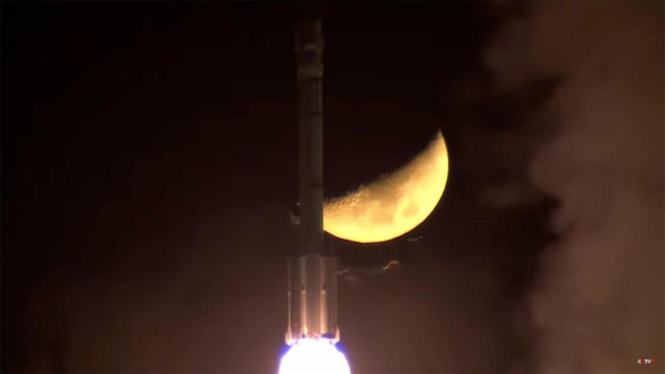The Long March 2F rocket carrying the Shenzhou 15 spacecraft passes in front of the moon seconds after liftoff, kicking off a problem-free climb to space. / Credit: CCTV