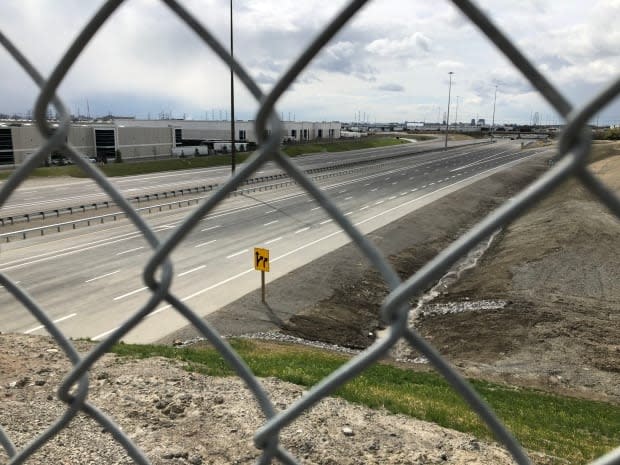 The $616-million Highway 427 extension appears complete, but remains off-limits to drivers as a legal dispute heads to court. (Sue Reid/CBC - image credit)