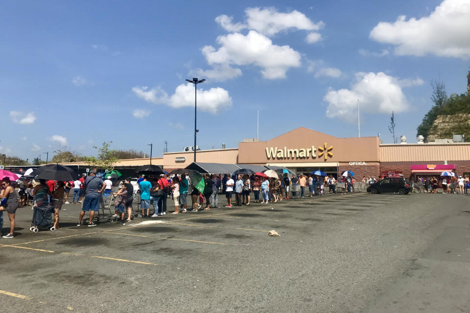 <p>Hundreds of people wait in line for hours at the Walmart in Bayamon, Puerto Rico on Sunday Oct. 8, 2017. (Photo: Caitlin Dickson/Yahoo News) </p>