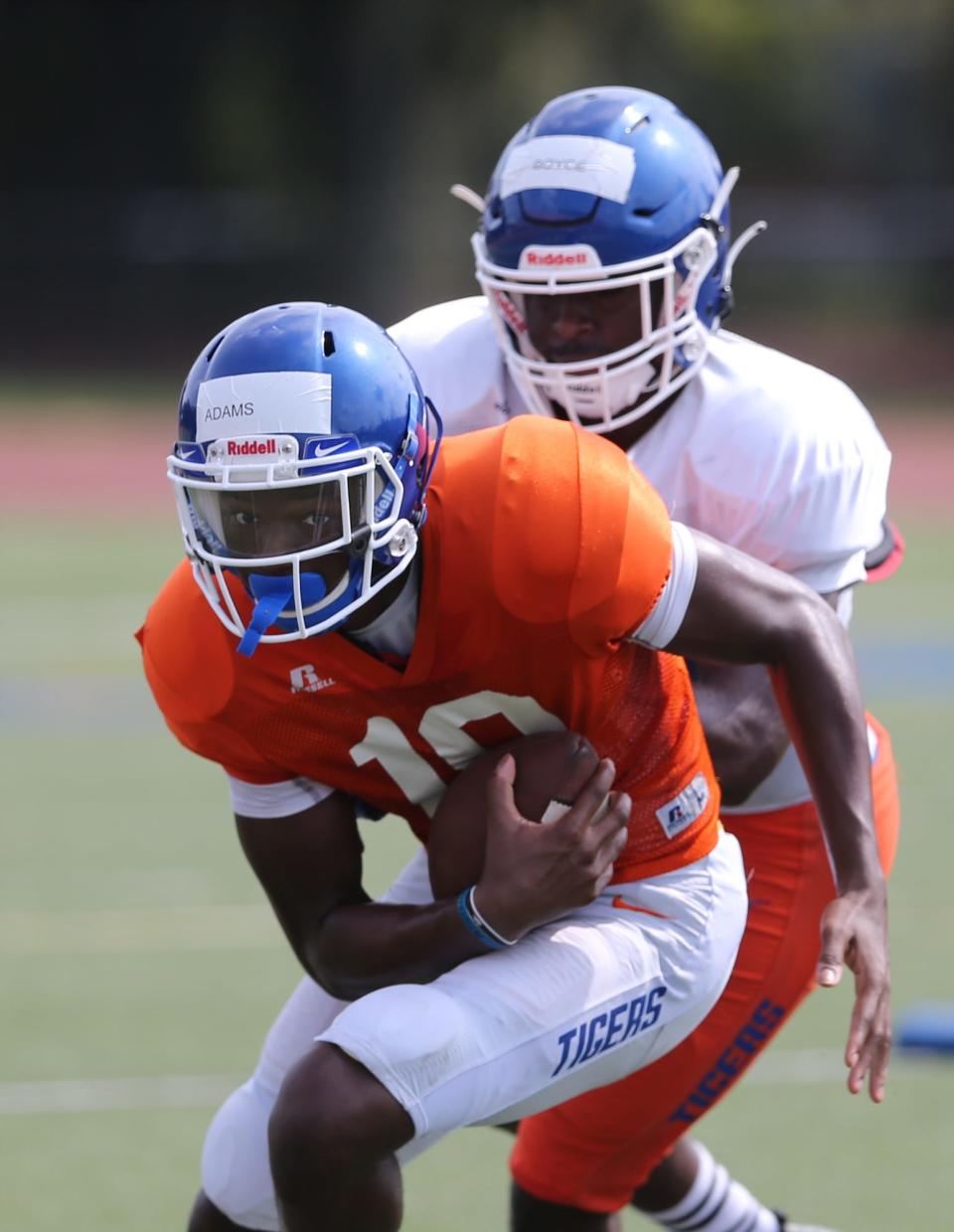 Savannah State quarterback Jadon Adams runs with the ball during practice.