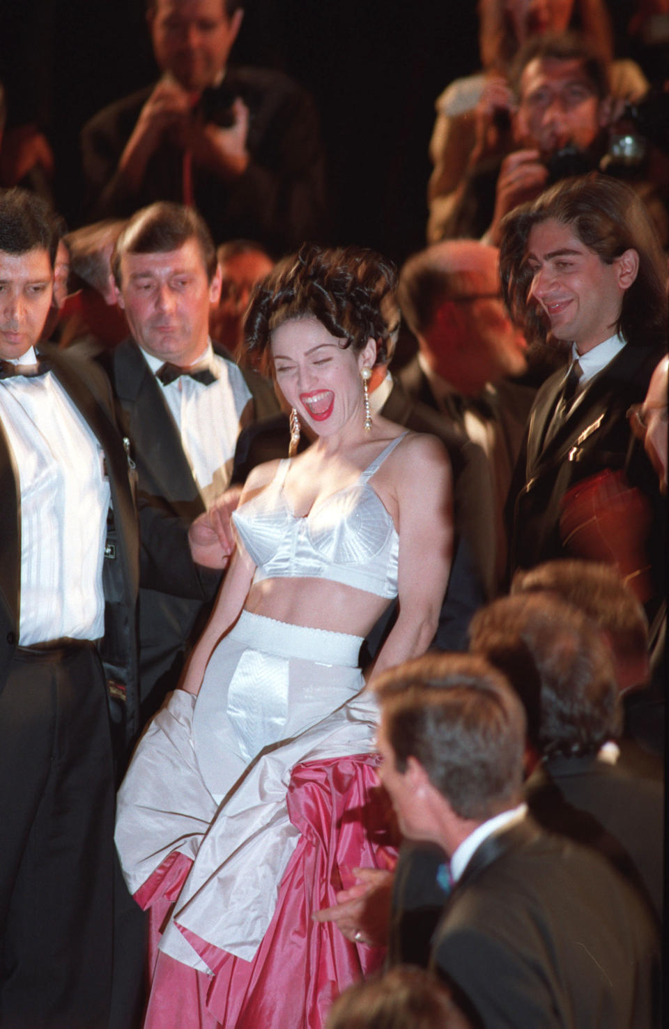 <p>Madonna wore a bralet version of her cone corset on the red carpet in Cannes in 1991, making one memorable appearance. <em>[Photo: Getty]</em> </p>