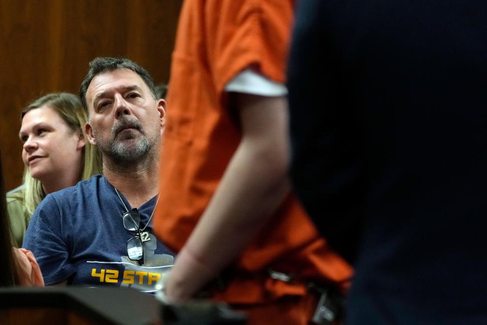 Buck Myre, father of slain Oxford student Tate Myre watches as Ethan Crumbley is escorted, on July 28, 2023, in Pontiac, Mich. Prosecutors are making their case that the Michigan teenager should be sentenced to life in prison for killing four students at his high school in 2021. Prosecutors introduced dark journal entries written by Ethan Crumbley, plus chilling video and testimony from a wounded staff member.