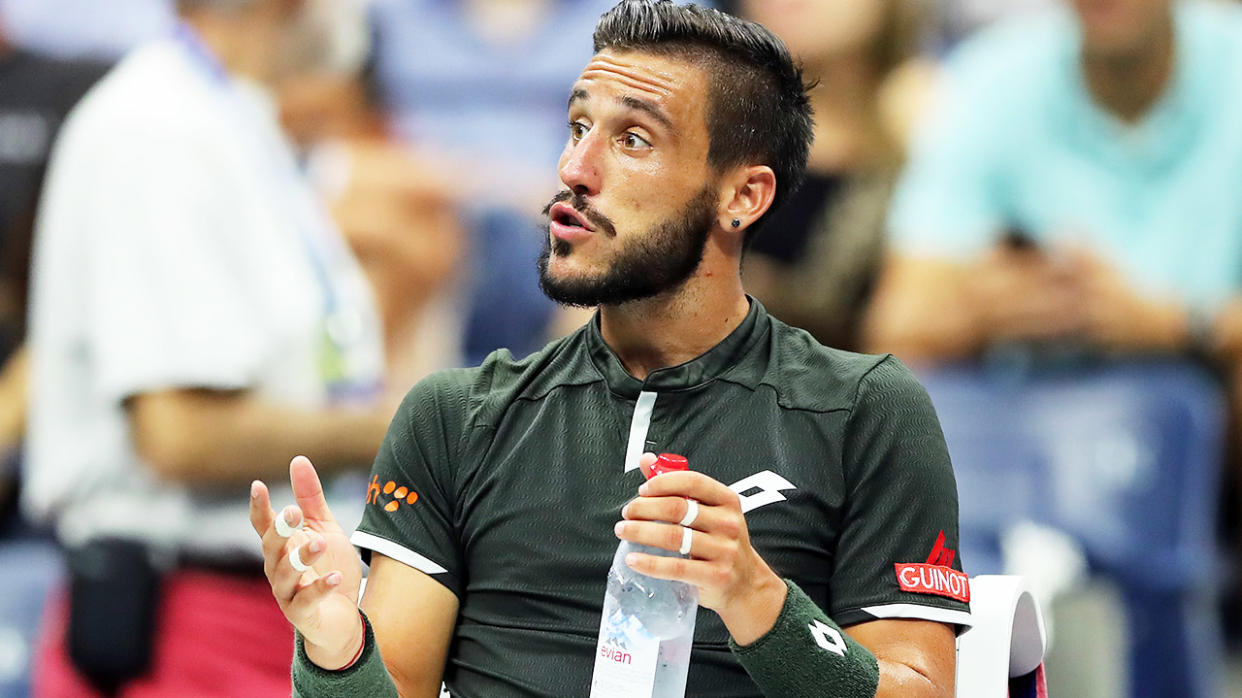 Damir Dzumhur getting frustrated during a tennis match.