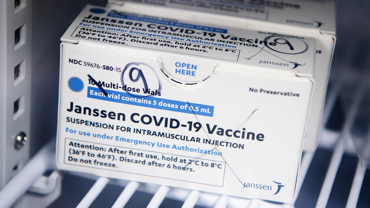 Box of Johnson & Johnson's Janssen COVID-19 vaccine doses on a refrigerator shelf