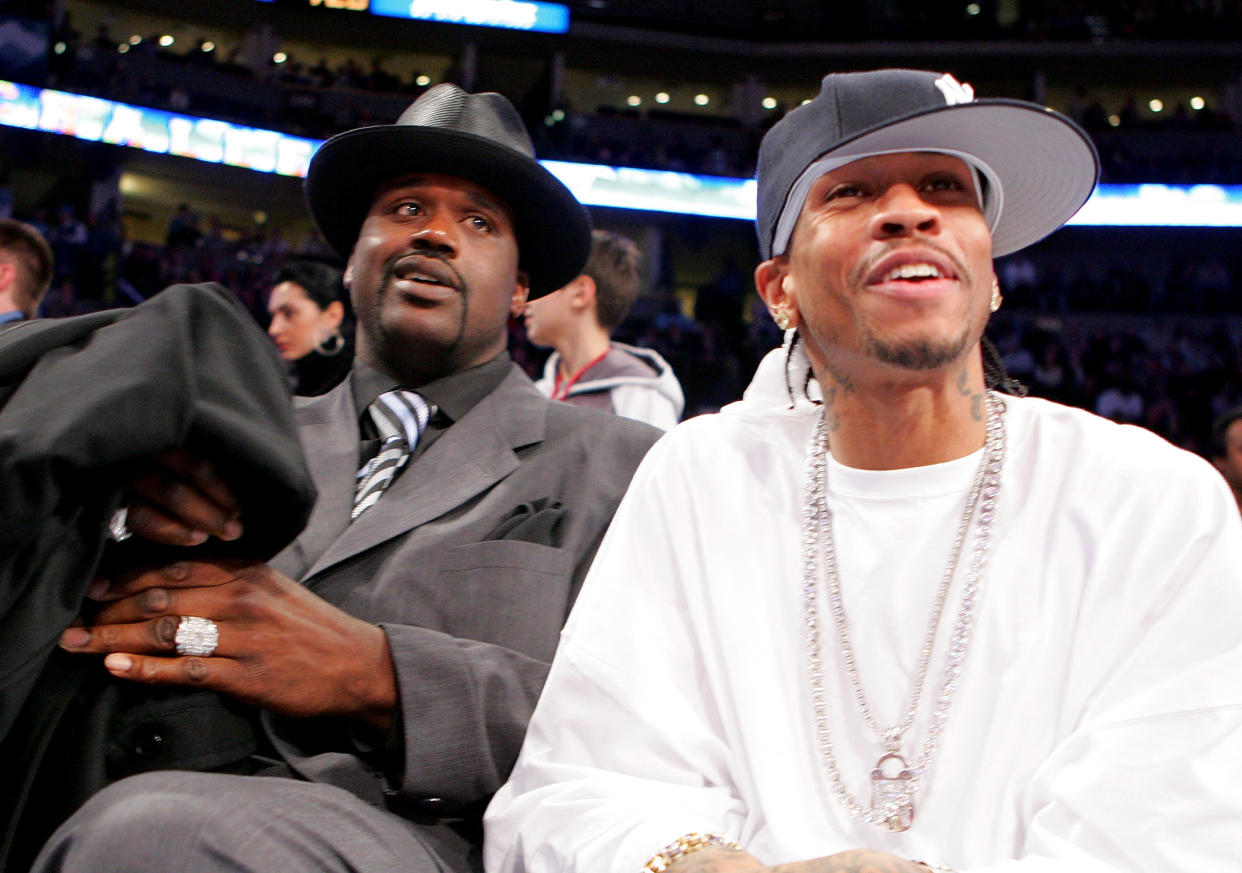 DENVER - FEBRUARY 18:  (L-R)All-Stars Shaquille O'Neal #34 of the Miami Heat and Allen Iverson #3 of the Philadelphia 76ers sit courtside during the got milk? Rookie Challenge, part of 2005 NBA All-Star Weekend at Pepsi Center on February 18, 2005 in Denver, Colorado.  NOTE TO USER: User expressly acknowledges and agrees that, by downloading and/or using this Photograph, user is consenting to the terms and conditions of the Getty Images License Agreement. (Photo by Ezra Shaw/Getty Images)