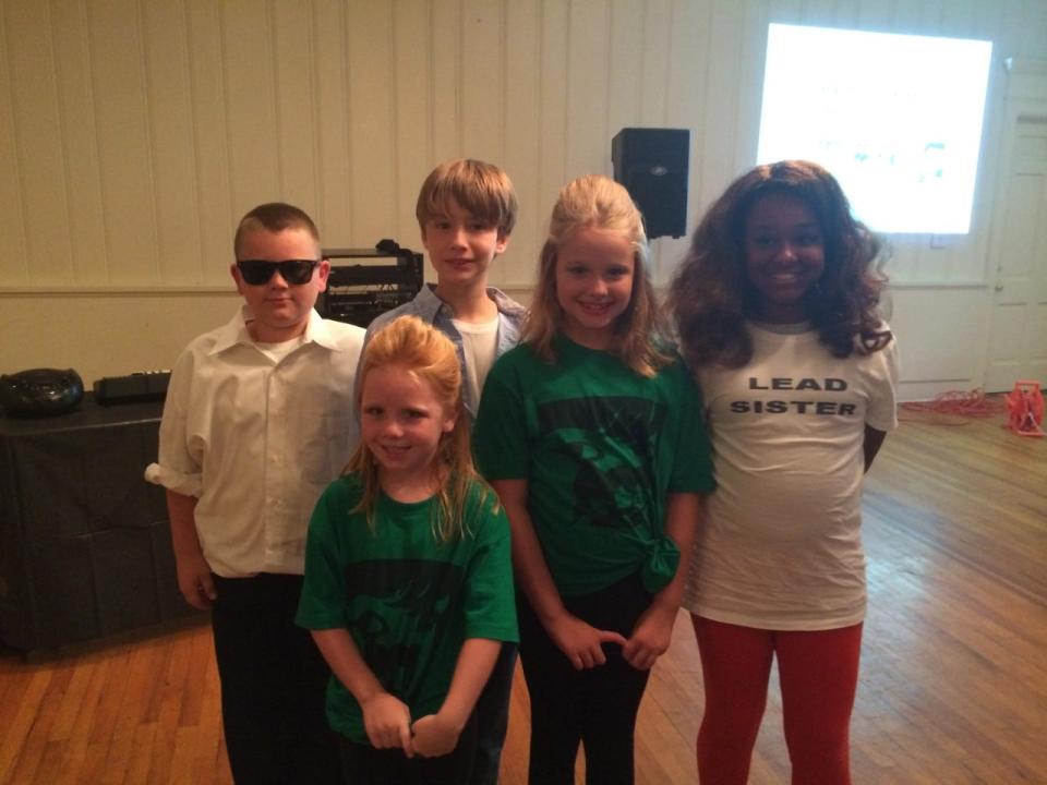 Patrick Hullett (far left, as Chubby Checker), Evan Richardson, Evan Richardson (as Richard Carpenter), Gracie Hullett (first row, left, as Ronette), Natalie Richardson (middle as Ronette) and Noel Herron ( far right as Karen Carpenter).