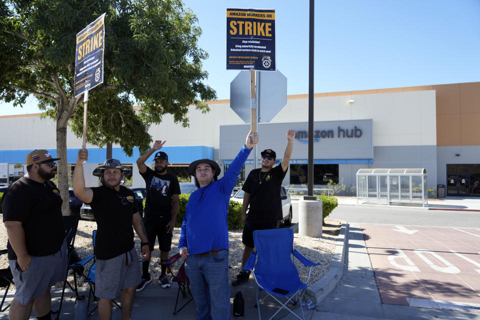 Workers picket outside one of the Amazon's distribution centers on Monday, July 24, 2023, in Palmdale, Calif. Dozens of Amazon drivers and dispatchers who work for a California-based delivery firm the Teamsters unionized in April have been picketing company warehouses, calling on the e-commerce behemoth to come to the table and bargain over pay and working conditions. (AP Photo/Marcio Jose Sanchez)
