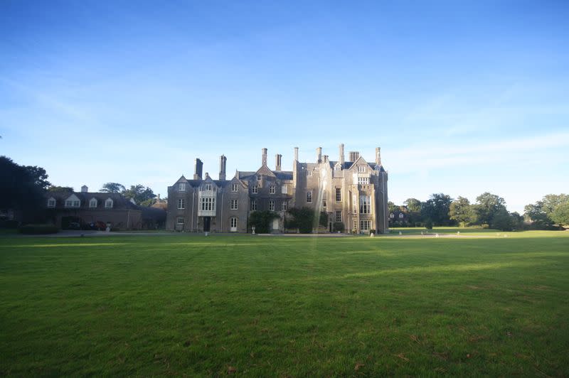 View across parkland to the enormous house