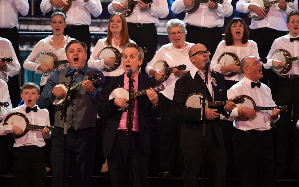 The George Formby Society featuring Frank Skinner, Harry Hill and Ed Balls perform at the Royal Albert Hall for the Queen's 92nd birthday in 2018 - Getty