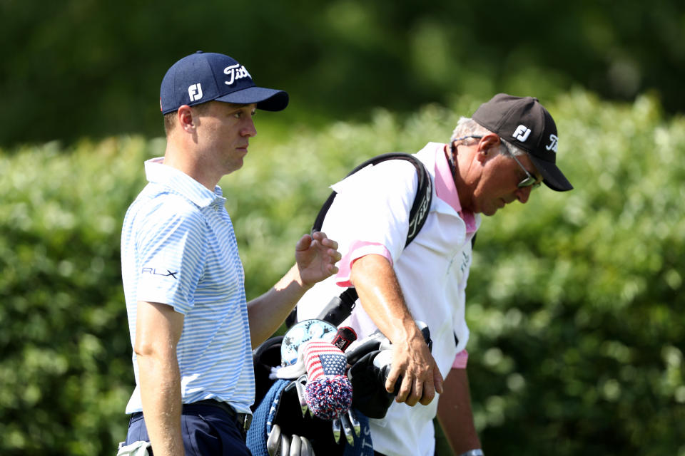 DUBLIN, OHIO - JULY 18: Justin Thomas of the United States and his father and caddie Mike Thomas walk on the 18th hole during the third round of The Memorial Tournament on July 18, 2020 at Muirfield Village Golf Club in Dublin, Ohio. (Photo by Jamie Squire/Getty Images)