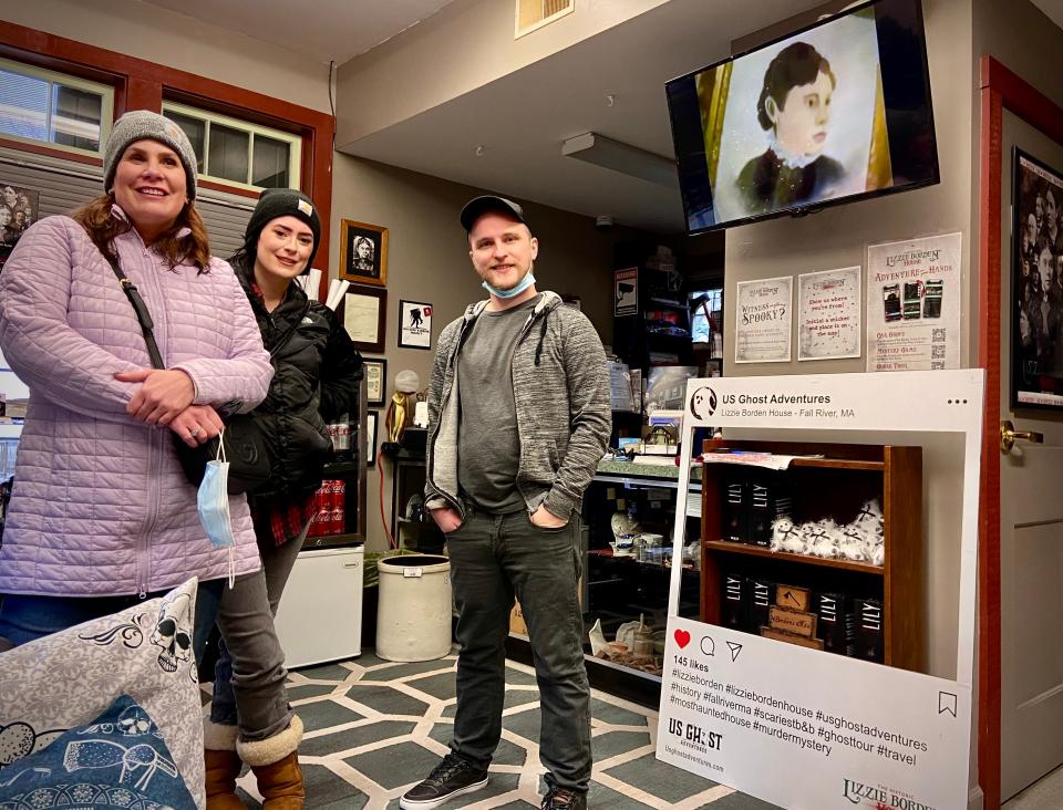 Jared Robinson, general manager of Lizzie Borden Bed and Breakfast Museum, is seen here in the gift shop with visitors Kristie Lesleman, left, and her daughter Corie Brundage.