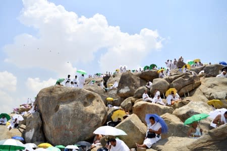 Muslim pilgrims pray on Mount of Mercy in Arafat ahead of the Eid al-Adha festival in Mecca