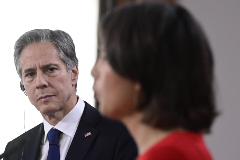 US Secretary of State Antony Blinken, left, and German Foreign Minister Annalena Baerbock, right, address the media during a joint press conference after a meeting in Berlin, Germany, Friday, June 24, 2022. (John MacDougall/Pool Photo via AP)