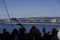 The Belem, the three-masted sailing ship which is carrying the Olympic flame, is accompanied by other boats approaching Marseille, southern France, Wednesday, May 8, 2024. After leaving Marseille, a vast relay route is undertaken before the torch odyssey ends on July 27 in Paris. The Paris 2024 Olympic Games will run from July 26 to Aug.11, 2024. (AP Photo/Thibault Camus)