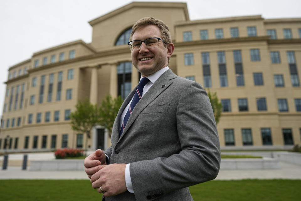 Supreme Court Justice Andrew Pinson poses for a photo, Wednesday, April 17, 2024, in Atlanta. Ga. Pinson, is running against John Barrow in a nonpartisan election for Supreme Court Justice, in May. (AP Photo/Mike Stewart)