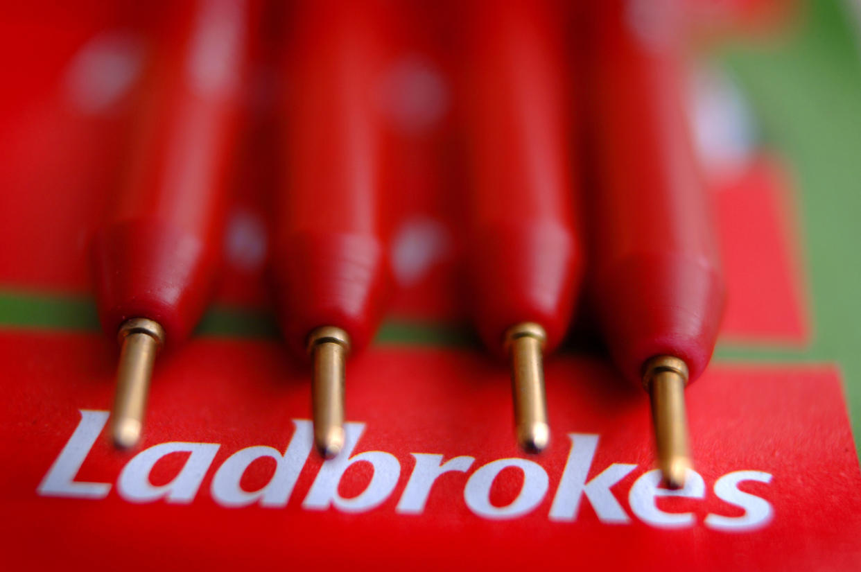 Small red pens on a Ladbrokes logo