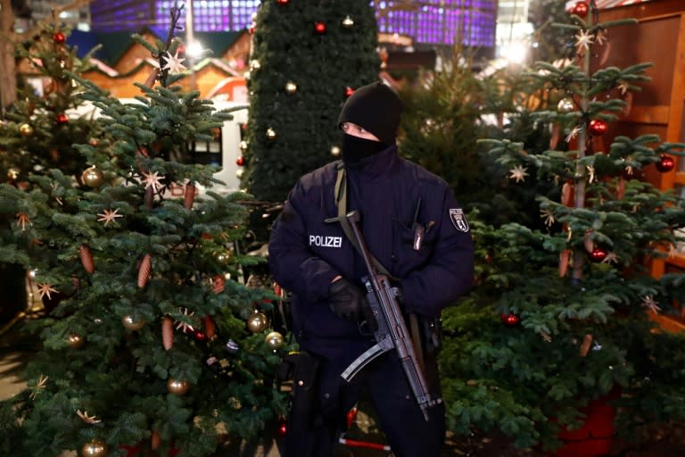 A policeman is seen at the Christmas market near the Kaiser-Wilhelm-Gedaechtniskirche (Kaiser Wilhelm Memorial Church), the day after a terror attack, in central Berlin, on December 20, 2016