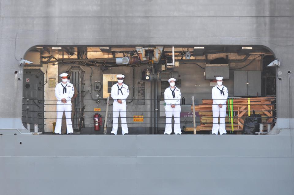 Crew members of the USS Detroit man the rail as the ship returns from a counter-narcotics deployment in this photo from last year.