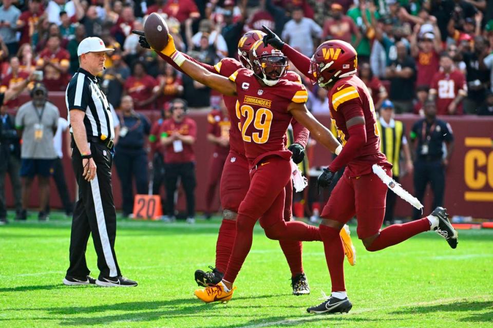 Oct 29, 2023; Landover, Maryland, USA; Washington Commanders cornerback Kendall Fuller (29) celebrates after a fumble recovery against the Philadelphia Eagles during the second half at FedExField. Mandatory Credit: Brad Mills-USA TODAY Sports