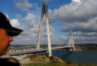 A riot police stands guard during the opening ceremony of newly built Yavuz Sultan Selim bridge, the third bridge over the Bosphorus linking the city's European and Asian sides, in Istanbul, Turkey, August 26, 2016. REUTERS/Murad Sezer