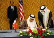 An Israeli delegation led by Israeli National Security Advisor Meir Ben Shabbat, signs an agreement with Bahraini officials in Manama