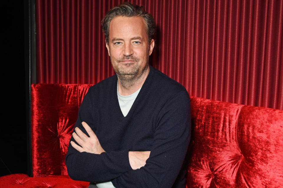 Matthew Perry poses at a photo call for 