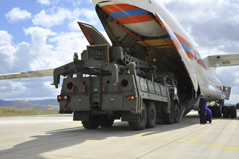 Military vehicles and equipment, parts of the S-400 air defense systems, are unloaded from a Russian transport aircraft, at Murted military airport in Ankara, Turkey, Friday, July 12, 2019. The first shipment of a Russian missile defense system has arrived in Turkey, the Turkish Defense Ministry said Friday, moving the country closer to possible U.S. sanctions and a new standoff with Washington. The U.S. has strongly urged NATO member Turkey to pull back from the deal, warning the country that it will face economic sanctions. (Turkish Defence Ministry via AP, Pool)