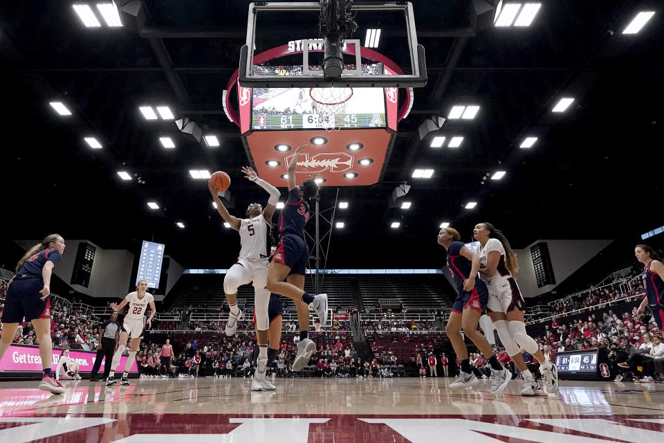 Stanford forward Francesca Belibi (5) shoots over Arizona forward Maya Nnaji (34) during the second half of an NCAA college basketball game Monday, Jan. 2, 2023, in Stanford, Calif. (AP Photo/Tony Avelar)