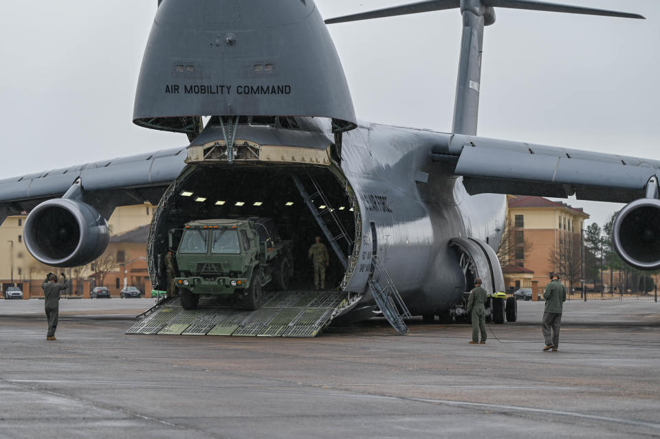 An aircrew from the 312th Airlift Squadron participates in an engine-running off-load training exercise, Jan. 8, 2023, at Maxwell Air Force Base, Alabama. The crew trained with the 25th Aerial Port Squadron to improve efficiency of the task while also maximizing shared military capabilities.