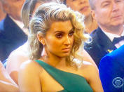 Shade or what? Tori Kelly dominated headlines after her seemingly unimpressed reaction to Taylor Swift's Album of the Year speech at the 2016 Grammys went viral. As Swift took to the stage, Best New Artist nominee Kelly sat back with her arms crossed — complete with an obvious pout — while other audience members appeared inspired by the two-time Album of the Year winner's remarks.