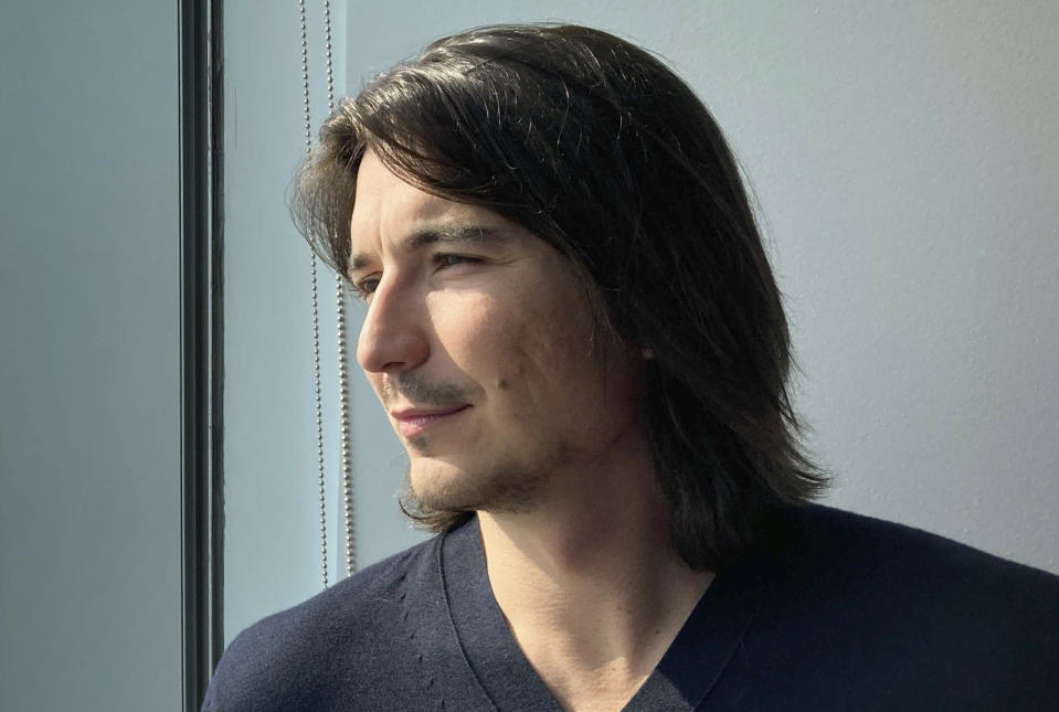 Robinhood CEO Vlad Tenev poses for a picture during an interview about the company that introduced a new generation of investors into the stock market and forced the industry to stop charging fees for trading, Wednesday, July 28, 2021, in New York. Shares of Robinhood Markets are set to begin trading on the Nasdaq for the first time Thursday. (AP Photo/David R. Martin)