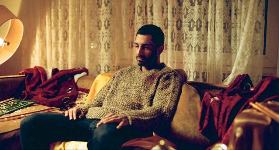 Riz Ahmed in a sweater