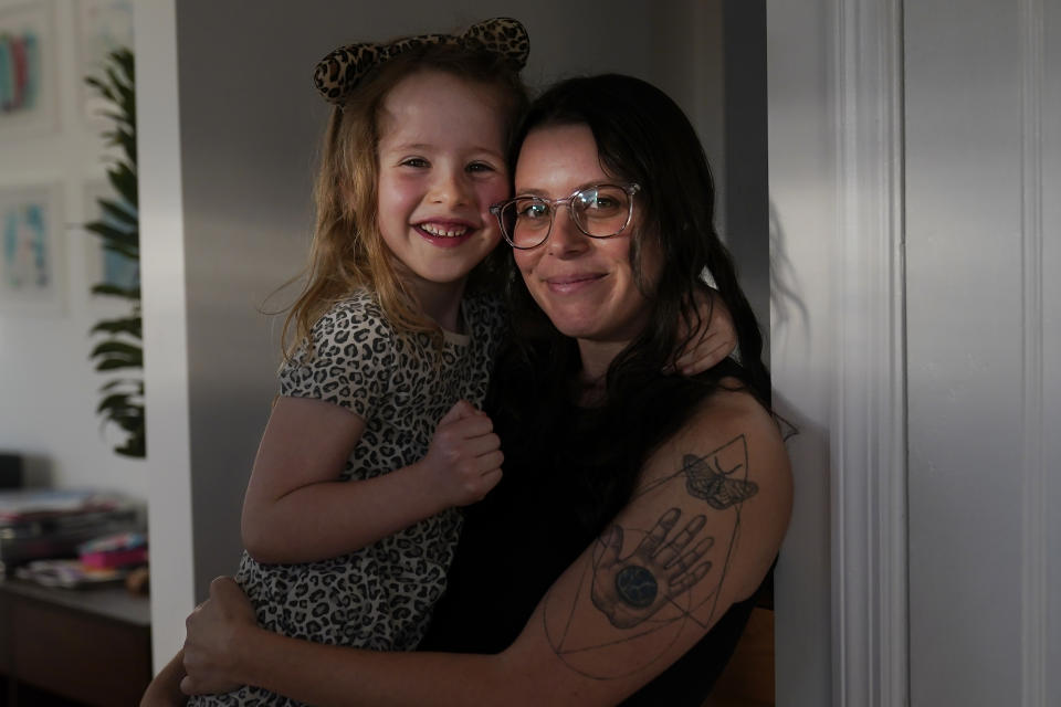 Hannah Levy holds her daughter Aylah, 6, in Albany, Calif., Wednesday, Nov. 8, 2023. (AP Photo/Jeff Chiu)