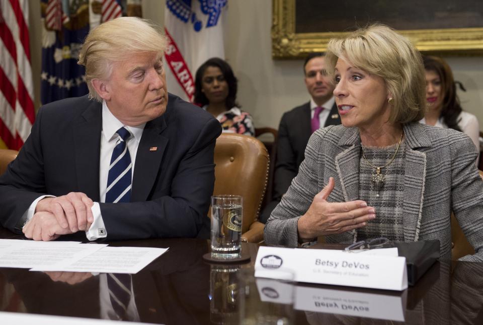 President Donald Trump and Secretary of Education Betsy DeVos meeting with teachers, school administrators and parents in 2017.