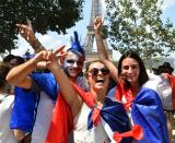 <p>French supporters gather for the FIFA World Cup 2018 final soccer match between France and Croatia on the Champ de Mars in Paris, France on July 15, 2018. (Getty Images) </p>