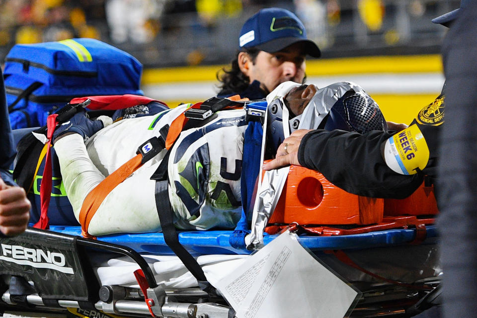 Darrell Taylor #52 of the Seattle Seahawks is carted off the field after an injury during a game against the Pittsburgh Steelers at Heinz Field on October 17, 2021 in Pittsburgh, Pennsylvania. (Photo by Joe Sargent/Getty Images)