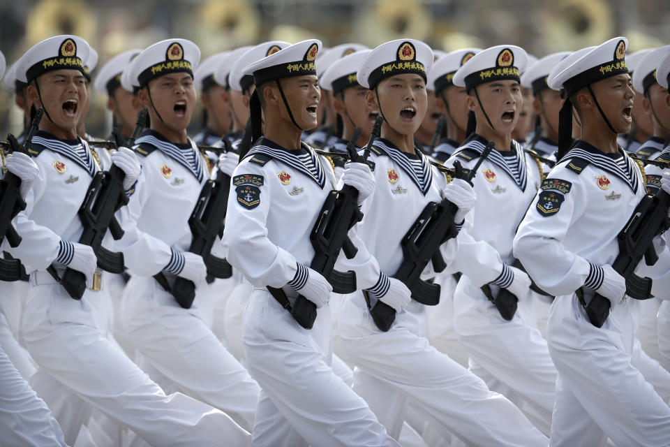 FILE - Soldiers from China's People's Liberation Army (PLA) Navy march in formation during a parade to commemorate the 70th anniversary of the founding of Communist China in Beijing, Oct. 1, 2019. With Russia’s military failings in Ukraine mounting, no country is paying closer attention than China to how a smaller, outgunned force has badly bloodied what was thought to be one of the world’s strongest armies. (AP Photo/Mark Schiefelbein, File)