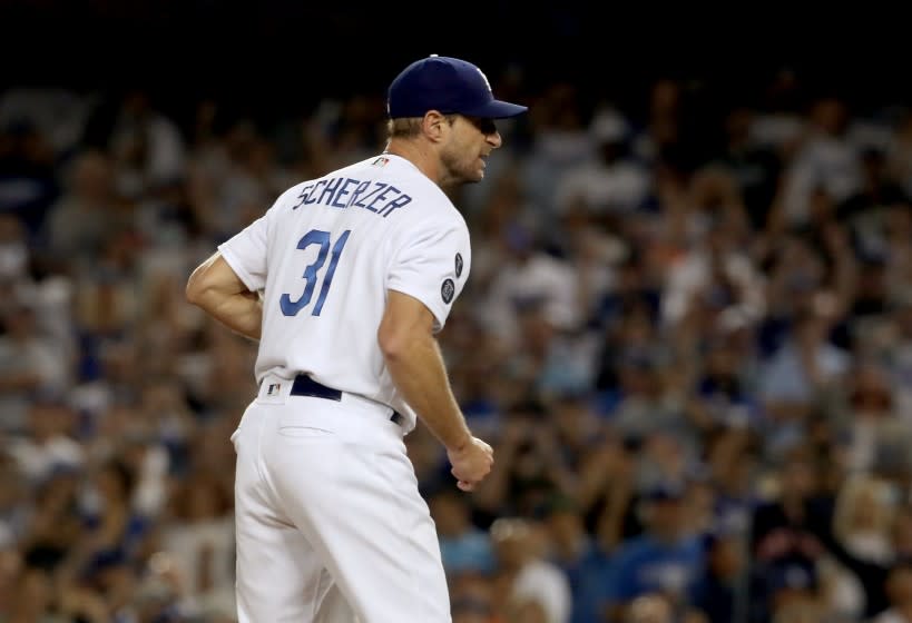 LOS ANGELES, CALIF. - AUG. 4, 2021. Dodgers starter Max Scherzer reacts after closing out the Astros in the seventh inning at Dodger Stadium on Wednesday, Aug. 34, 2021. (Luis Sinco / Los Angeles Times)